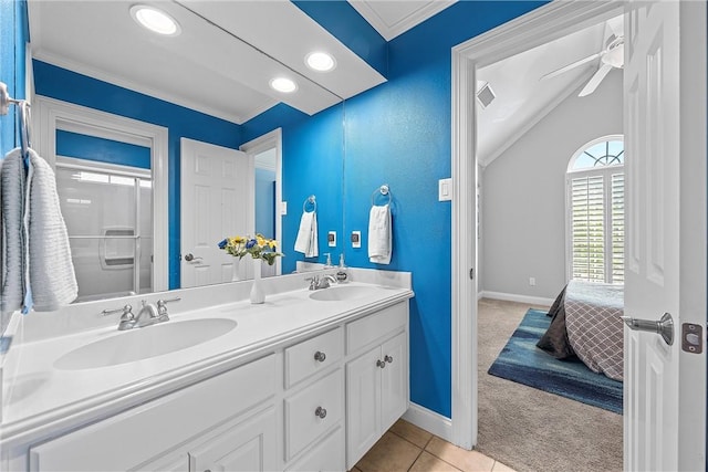 bathroom featuring tile patterned flooring, vanity, ceiling fan, and crown molding