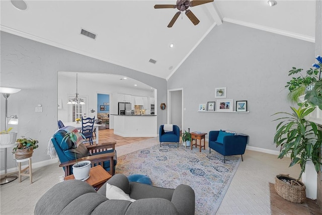 living room with beam ceiling, ceiling fan with notable chandelier, and high vaulted ceiling