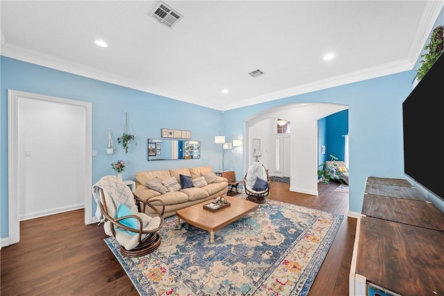 living room featuring dark hardwood / wood-style flooring and ornamental molding