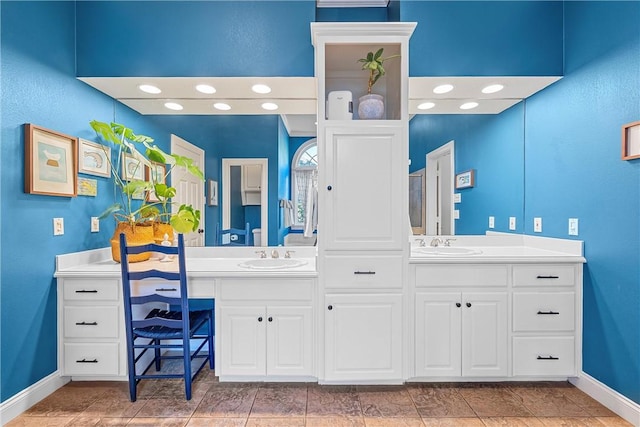 bathroom with vanity and tile patterned floors