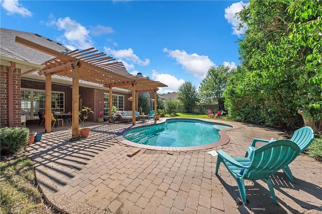 view of pool with outdoor lounge area, a patio area, and a pergola