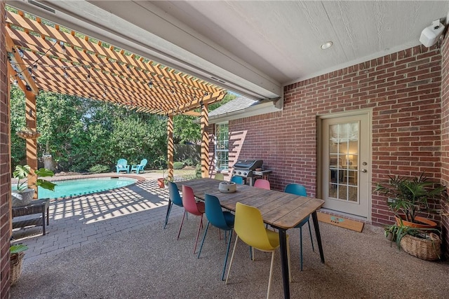 view of patio / terrace with a pergola and a grill