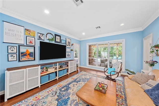 living room with hardwood / wood-style floors and ornamental molding