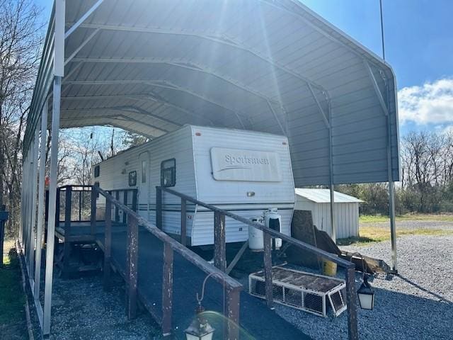 view of side of property with a carport