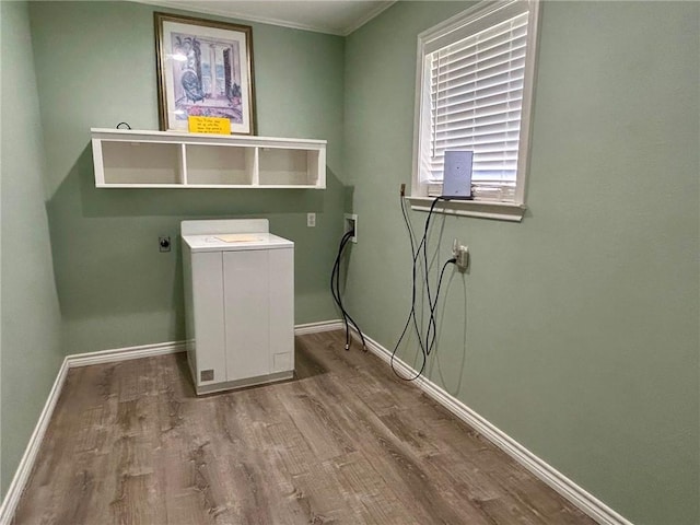 washroom with washer / clothes dryer and wood-type flooring