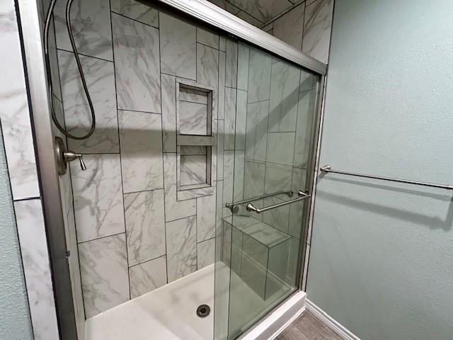 bathroom with an enclosed shower