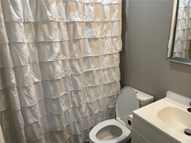 bathroom with vanity and toilet