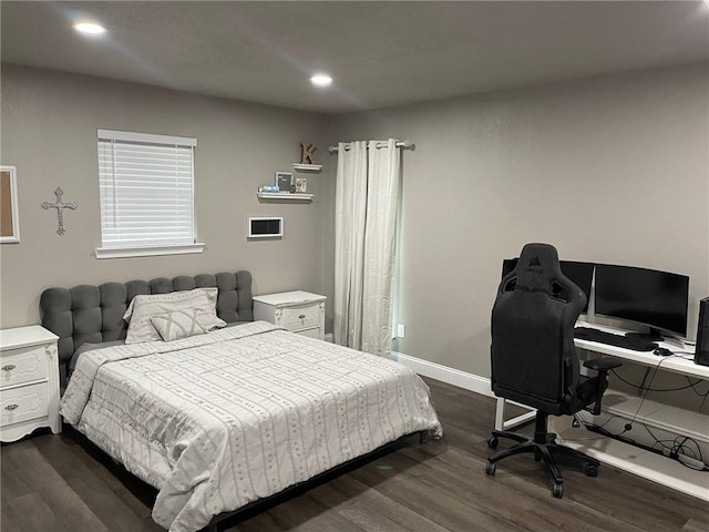 bedroom featuring dark hardwood / wood-style flooring