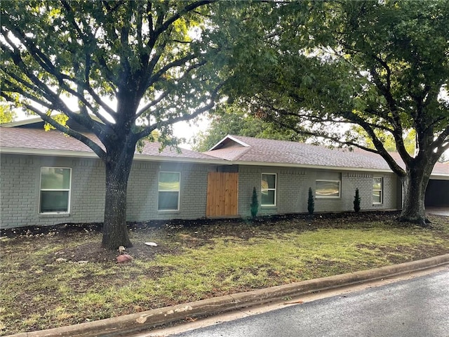 ranch-style house with a front yard