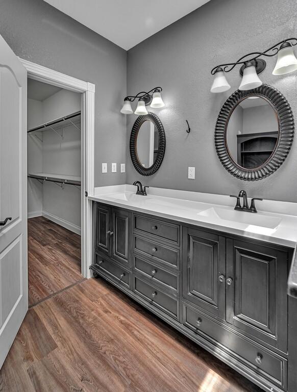 bathroom with vanity and hardwood / wood-style flooring