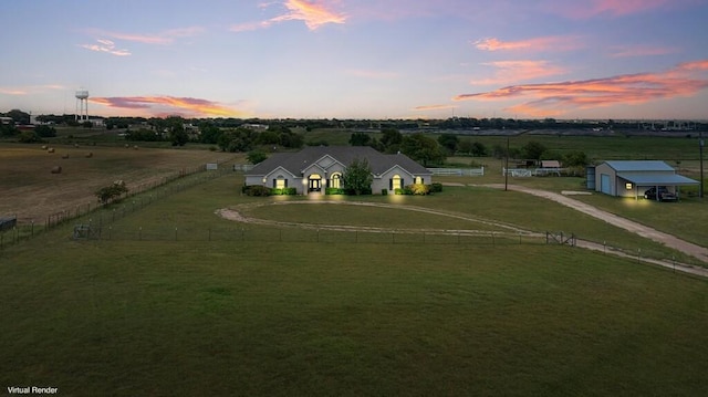 view of front of home with a rural view