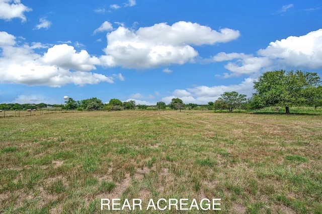 view of yard with a rural view