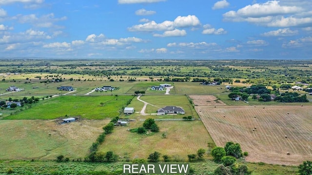 birds eye view of property with a rural view