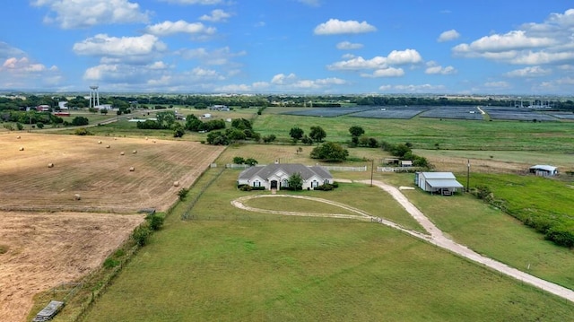 birds eye view of property with a rural view