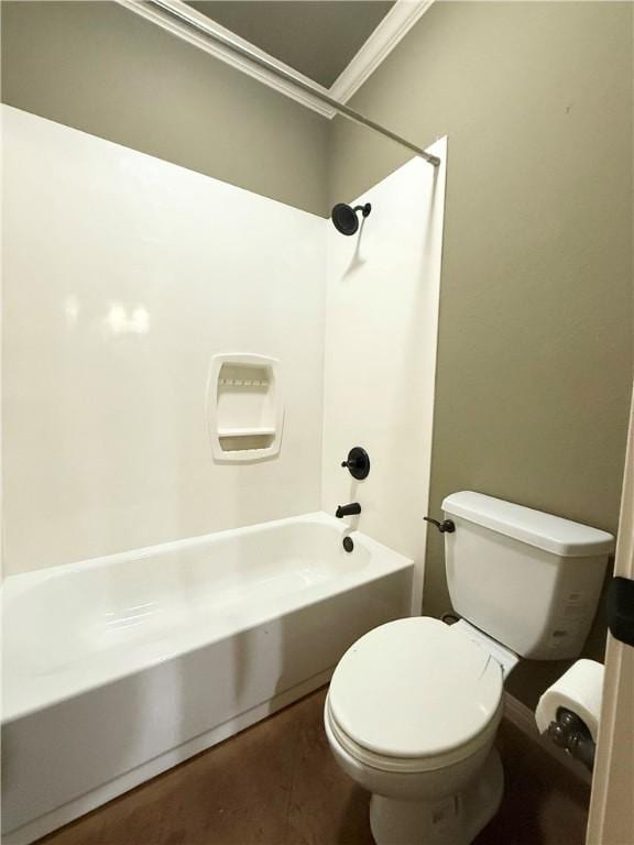 full bath with bathing tub / shower combination, toilet, and ornamental molding