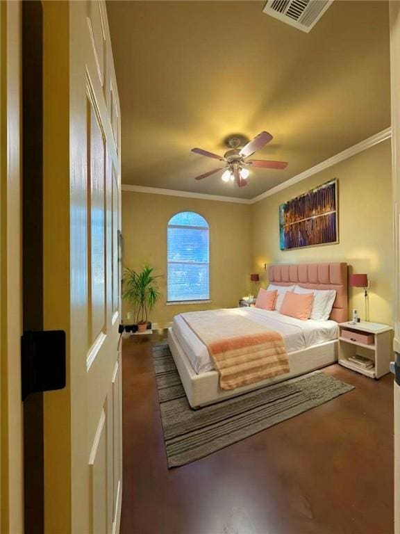 bedroom with ornamental molding, visible vents, and ceiling fan