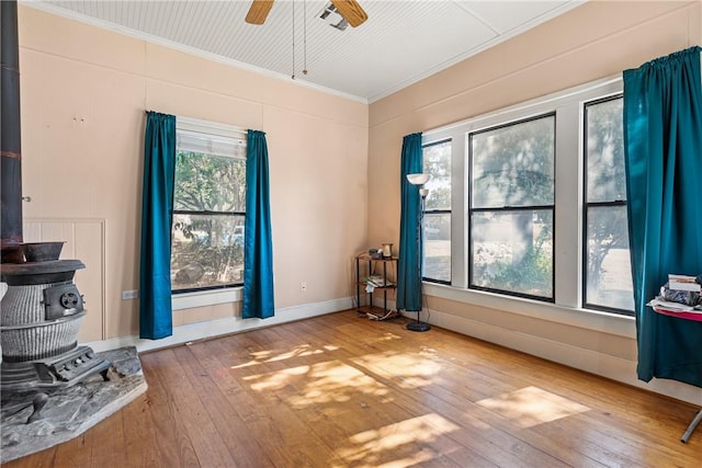 miscellaneous room featuring hardwood / wood-style floors, ceiling fan, and crown molding