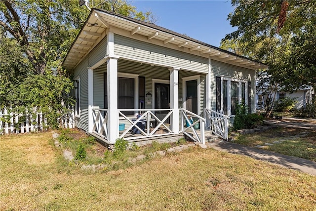 exterior space featuring a porch and a front yard