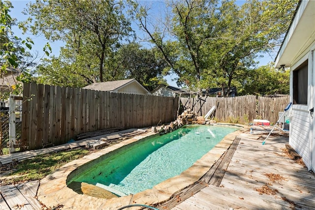 view of swimming pool featuring a wooden deck