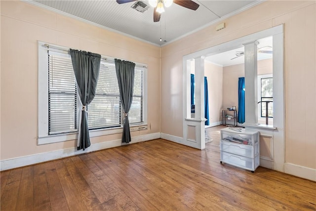 unfurnished room featuring hardwood / wood-style floors, ceiling fan, and ornamental molding