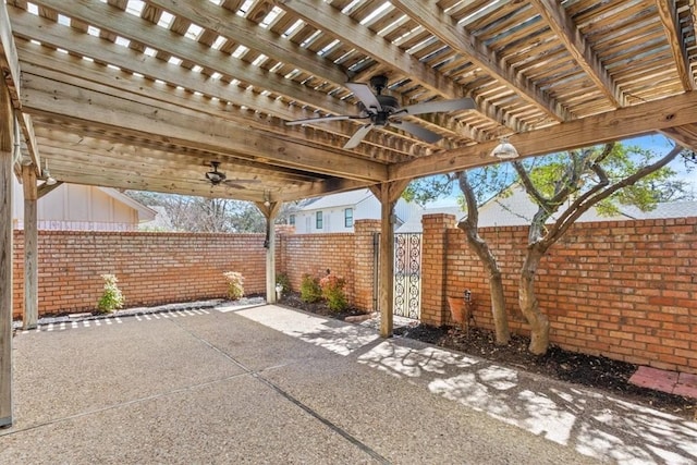 view of patio / terrace with a fenced backyard, ceiling fan, and a pergola