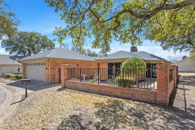 ranch-style house with fence, concrete driveway, a garage, brick siding, and a chimney