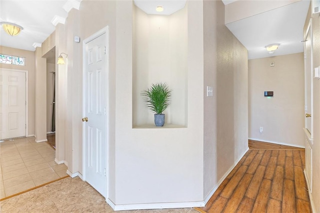 corridor featuring hardwood / wood-style floors