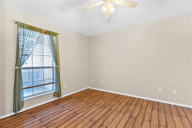 spare room featuring hardwood / wood-style flooring and ceiling fan