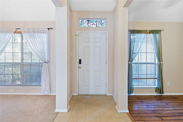 entrance foyer with light carpet