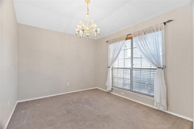 unfurnished room featuring carpet flooring and a chandelier