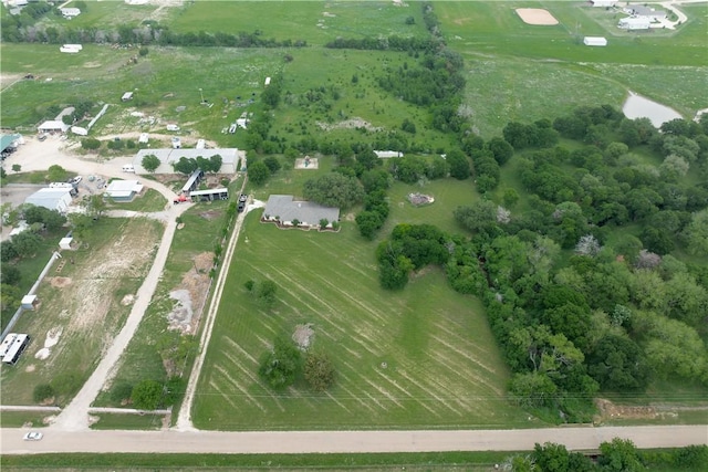 birds eye view of property featuring a rural view