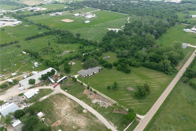 birds eye view of property with a rural view