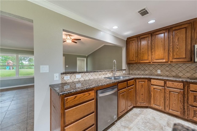 kitchen featuring decorative backsplash, stainless steel dishwasher, dark stone counters, crown molding, and sink