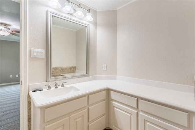 bathroom featuring ceiling fan and vanity