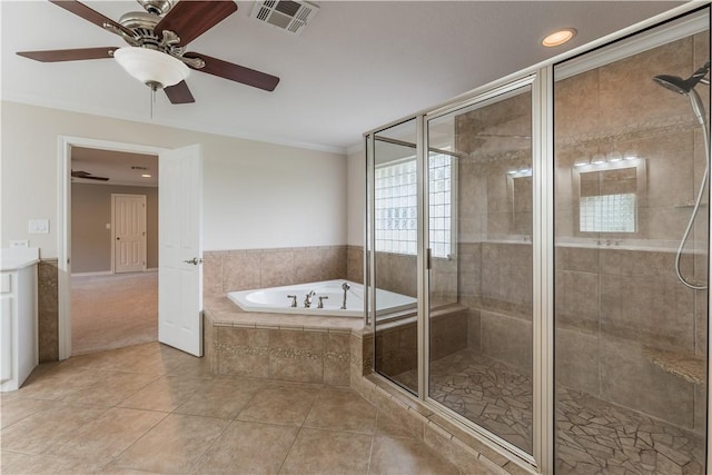 bathroom featuring ceiling fan, tile patterned floors, shower with separate bathtub, vanity, and ornamental molding