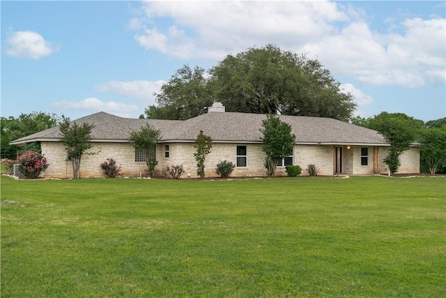 ranch-style house with a front lawn