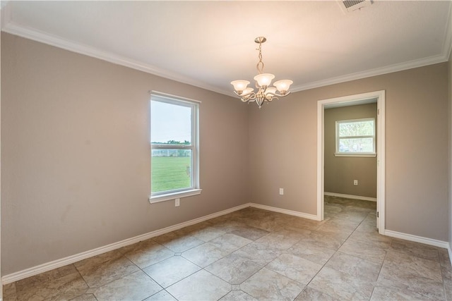 empty room featuring a chandelier and crown molding