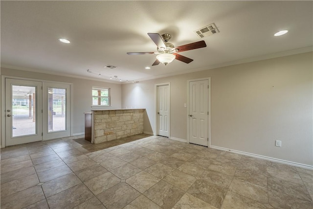 empty room with ceiling fan and crown molding