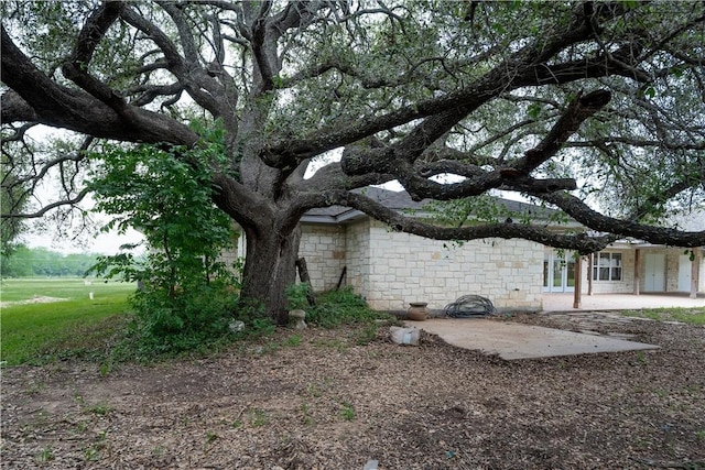 view of yard featuring french doors and a patio