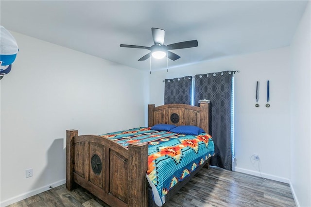 bedroom with ceiling fan and dark hardwood / wood-style flooring