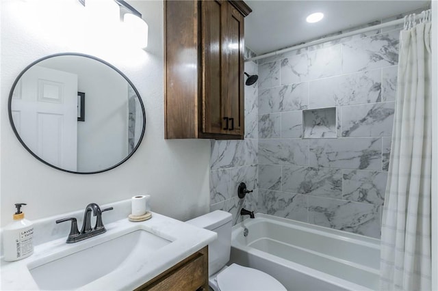 full bathroom featuring vanity, toilet, and shower / tub combo