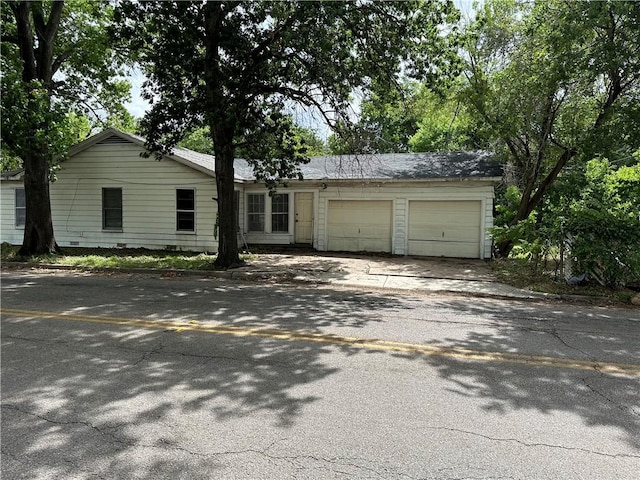 single story home featuring a garage