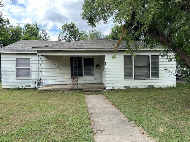 view of front of home with a front yard and a porch