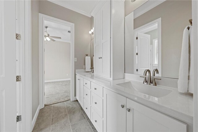 bathroom with vanity, tile patterned floors, ceiling fan, and ornamental molding