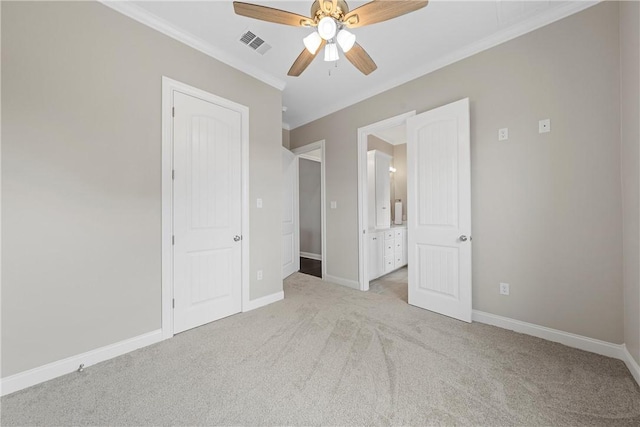 unfurnished bedroom featuring ceiling fan, light colored carpet, ornamental molding, and connected bathroom