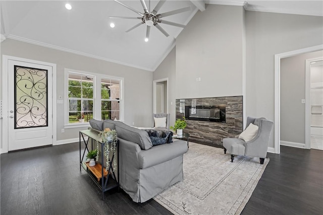 living room with dark hardwood / wood-style flooring, high vaulted ceiling, a stone fireplace, and ceiling fan