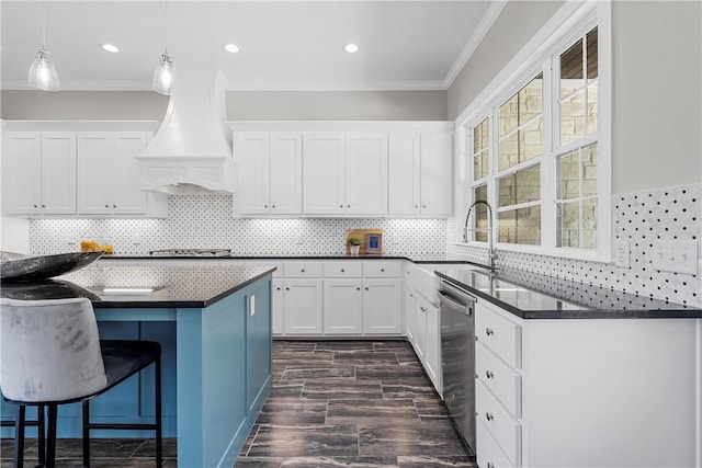 kitchen with ornamental molding, white cabinets, custom exhaust hood, and appliances with stainless steel finishes