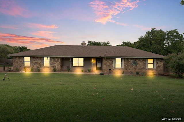 ranch-style house featuring a yard