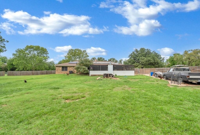 view of yard with a sunroom