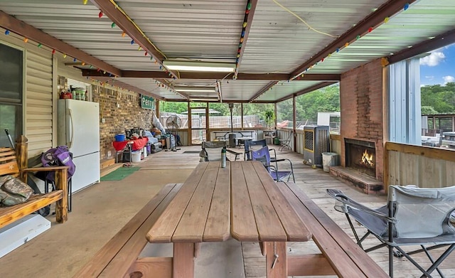 exterior space featuring an outdoor brick fireplace